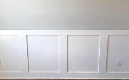 A white wall with white doors.