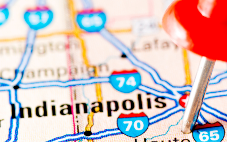 A red balloon on a map.