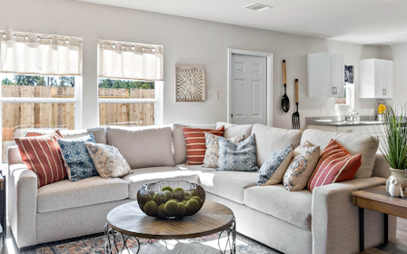 A living room with a couch and coffee table.