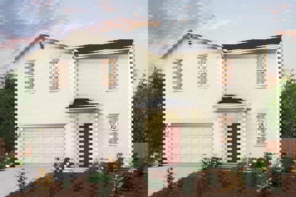 A white house with a garage.