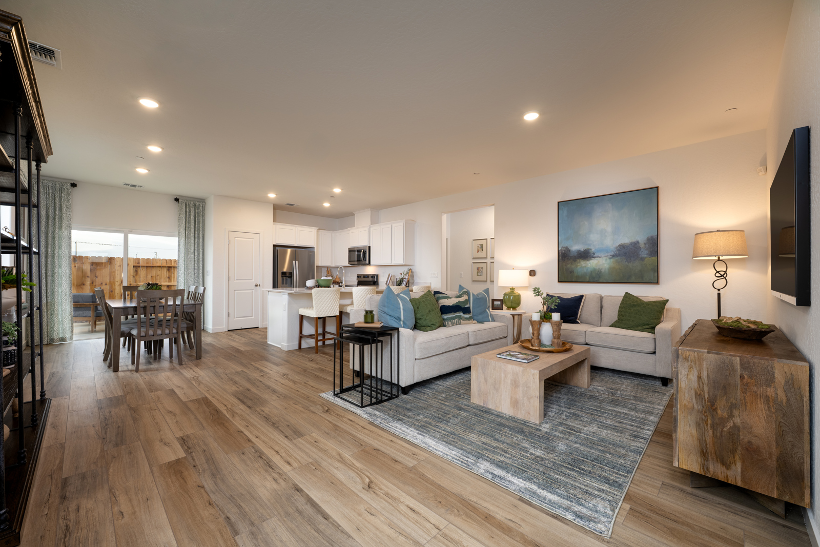 A living room with a wood floor.