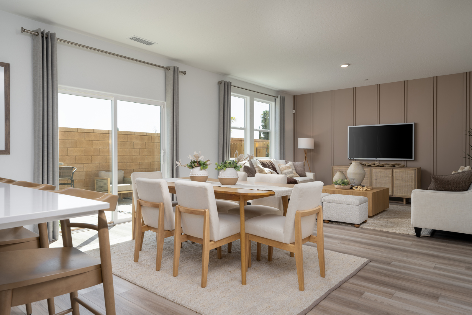 A living room with a tv and chairs.