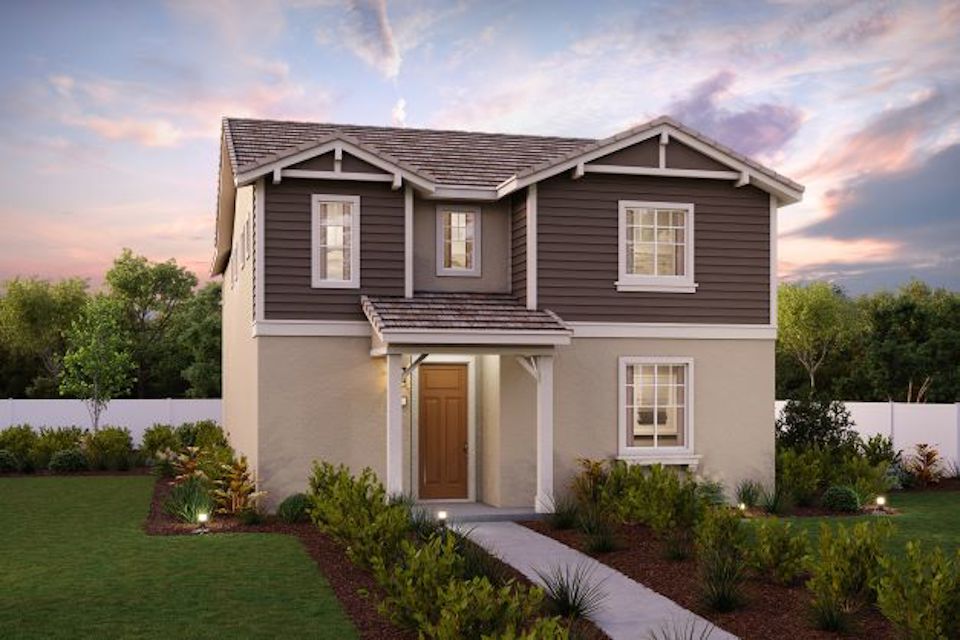 A house with a yard and a fence.