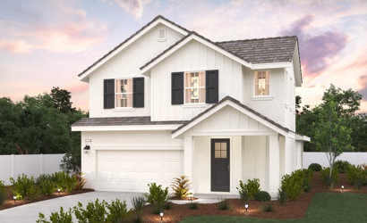 A white house with a driveway.