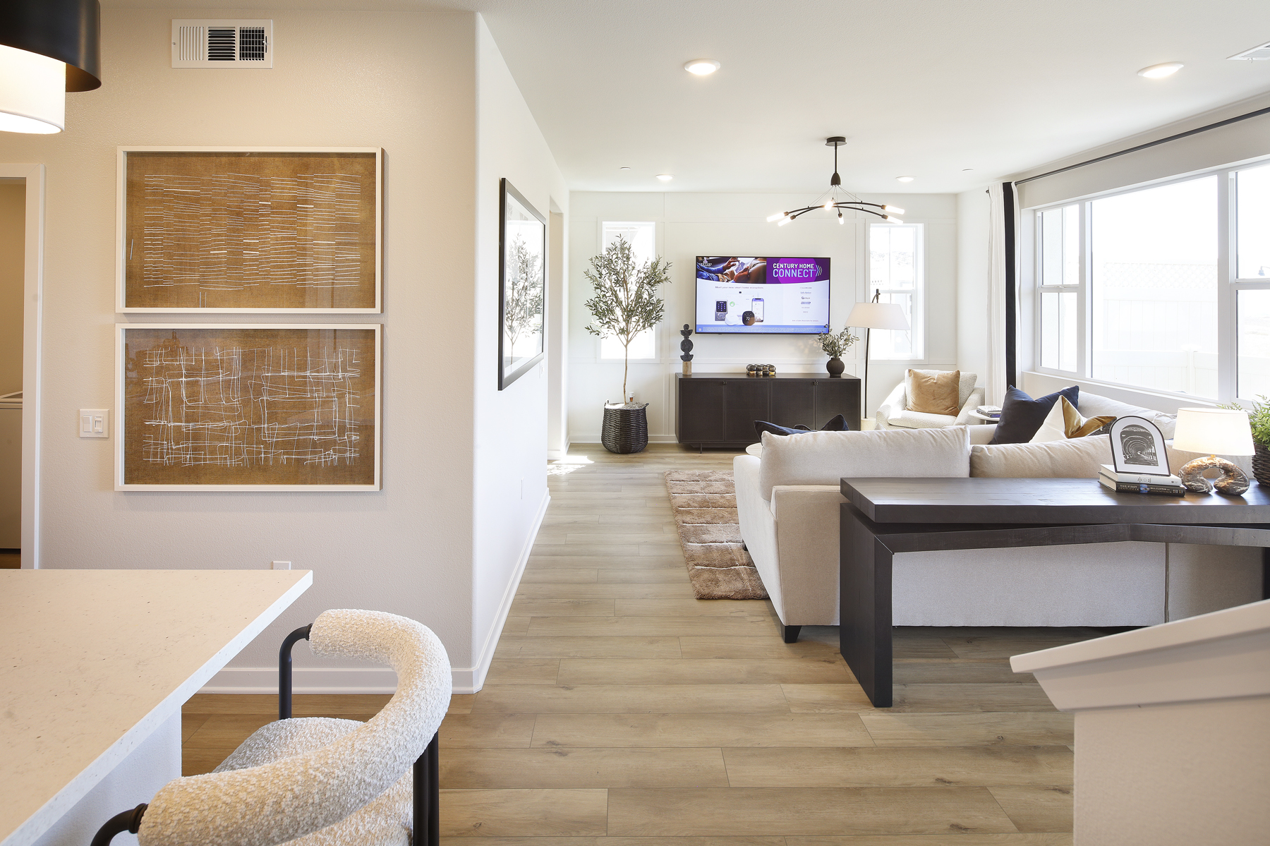 A living room with a large television.