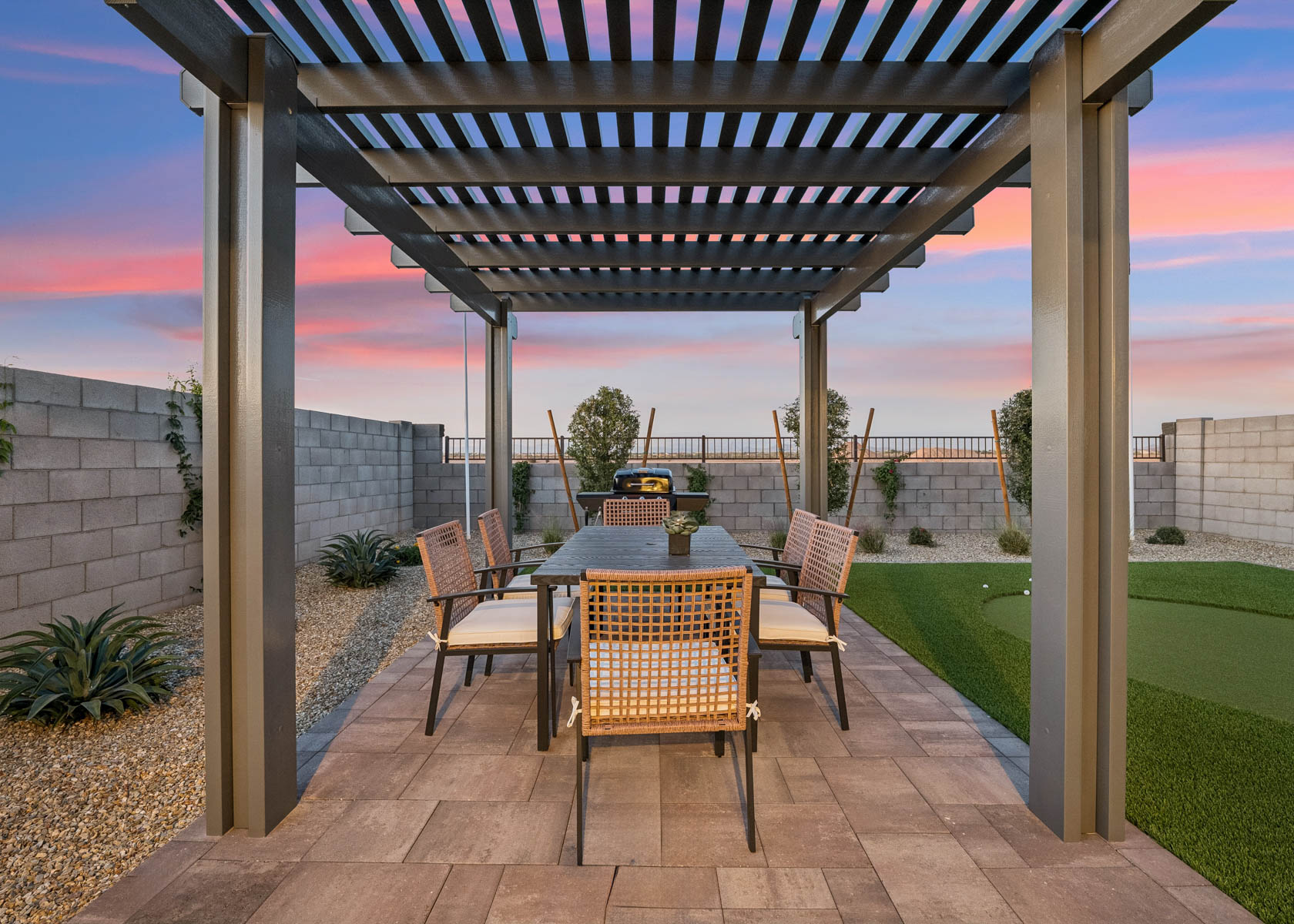 A patio with a table and chairs.