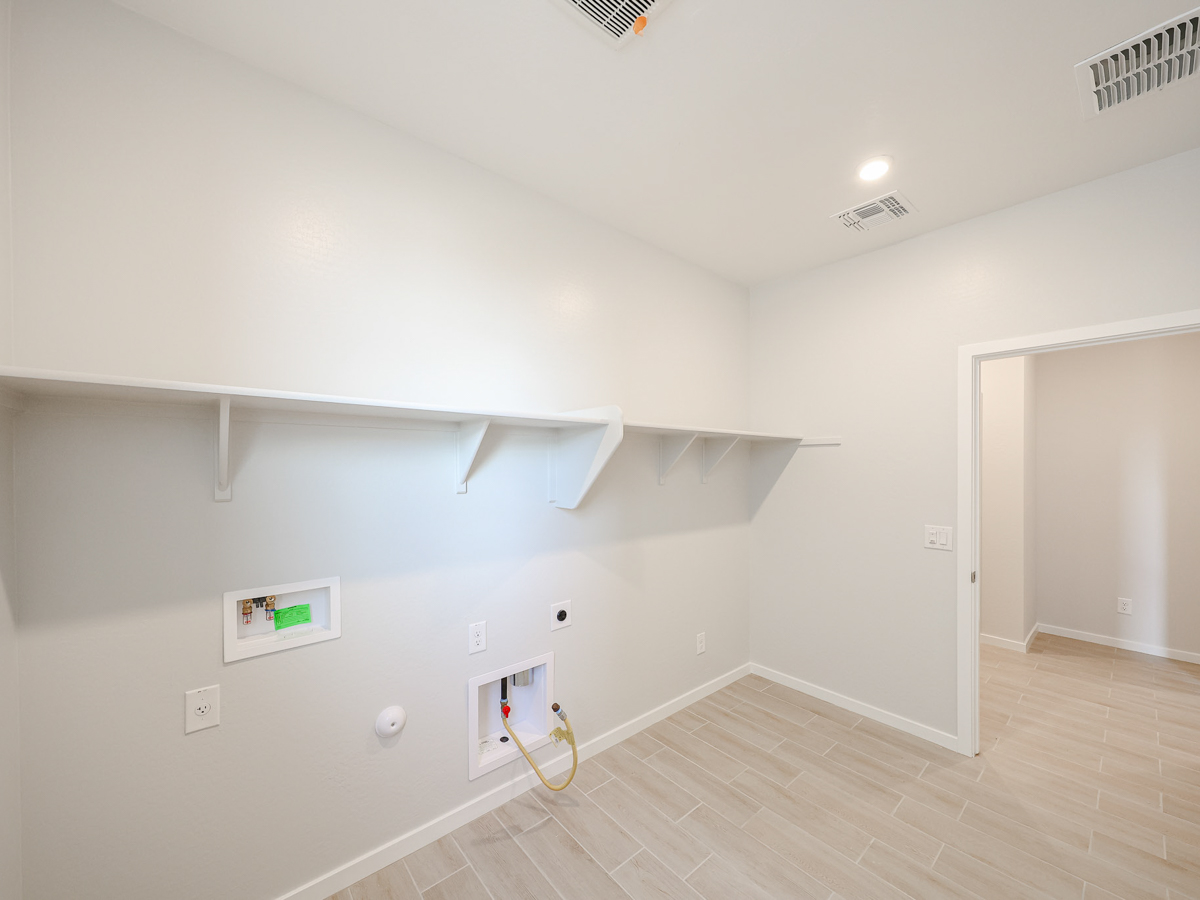 A room with a white wall and a white door.