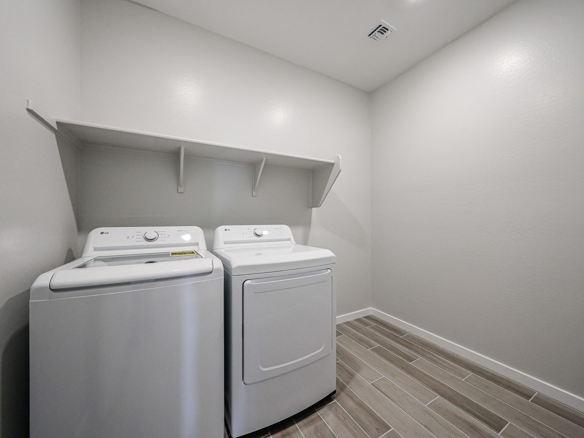 A washer and dryer in a room.