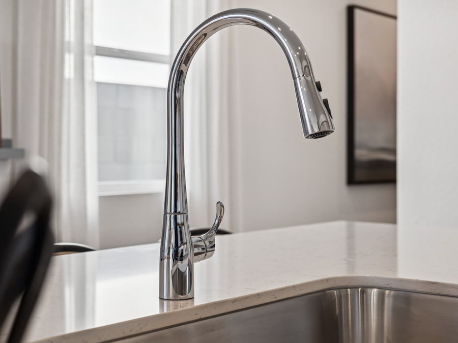 A faucet on a counter.