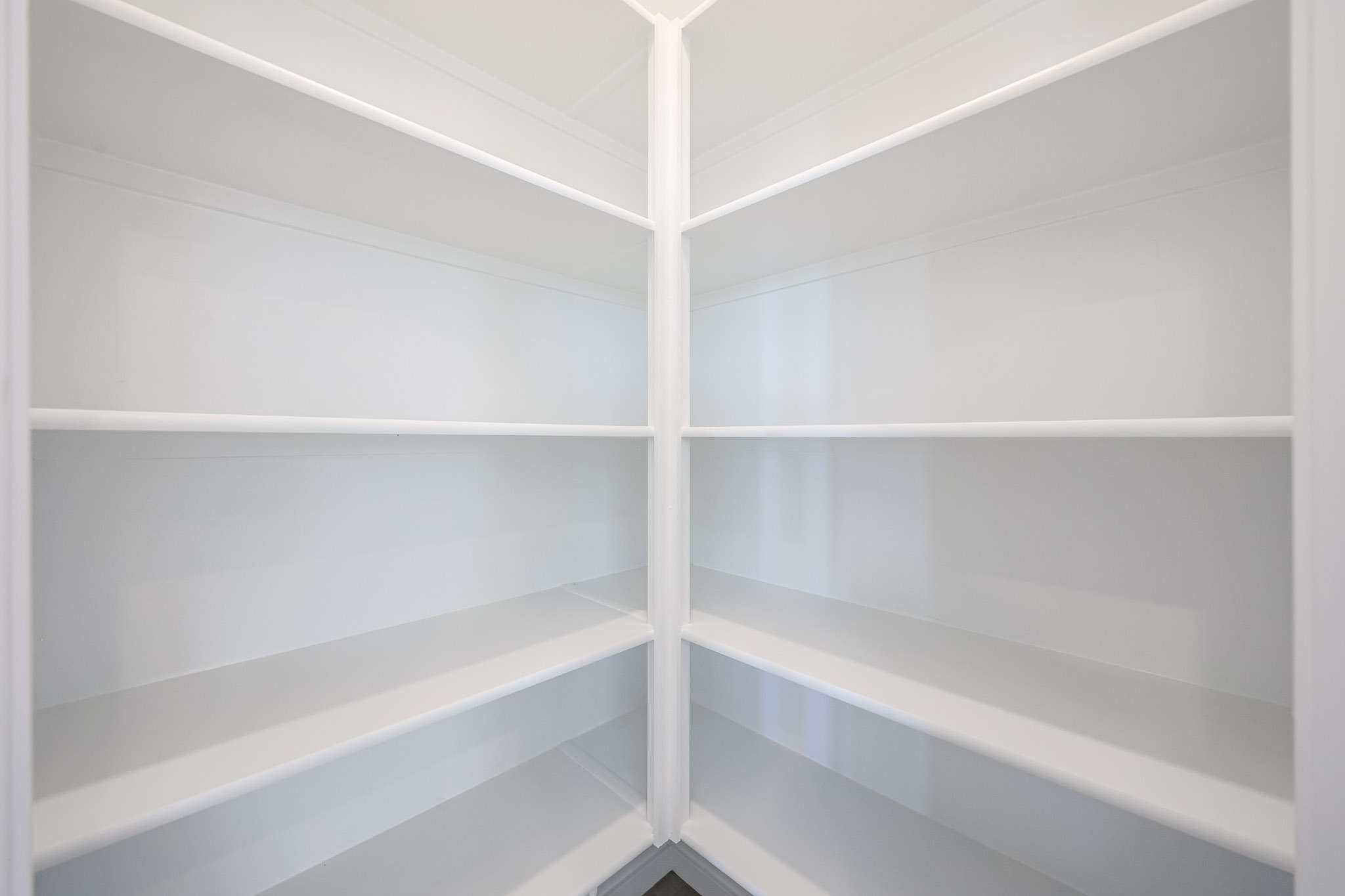 A white ceiling with white beams.