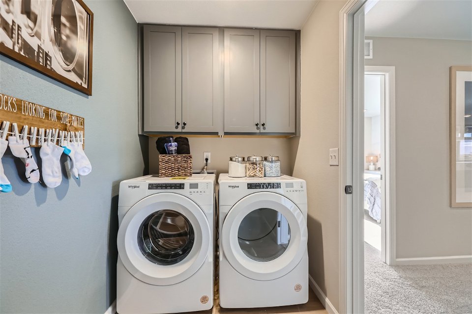A laundry room with a washer and dryer.