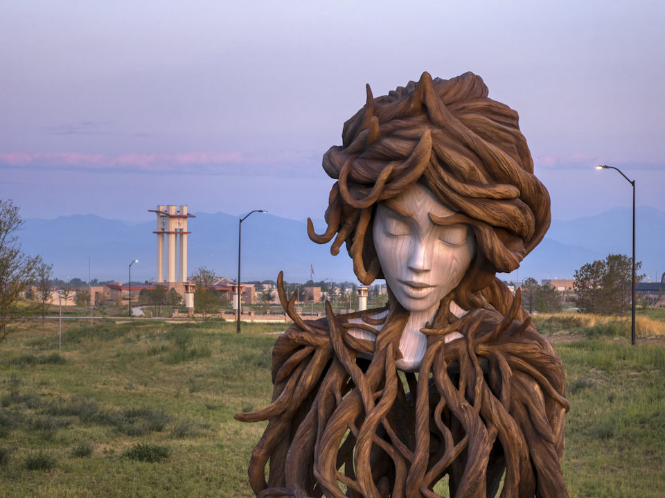 A statue of a person with a large head.