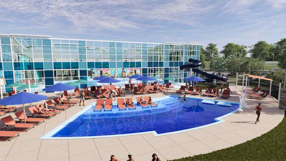 A swimming pool with people sitting around it.