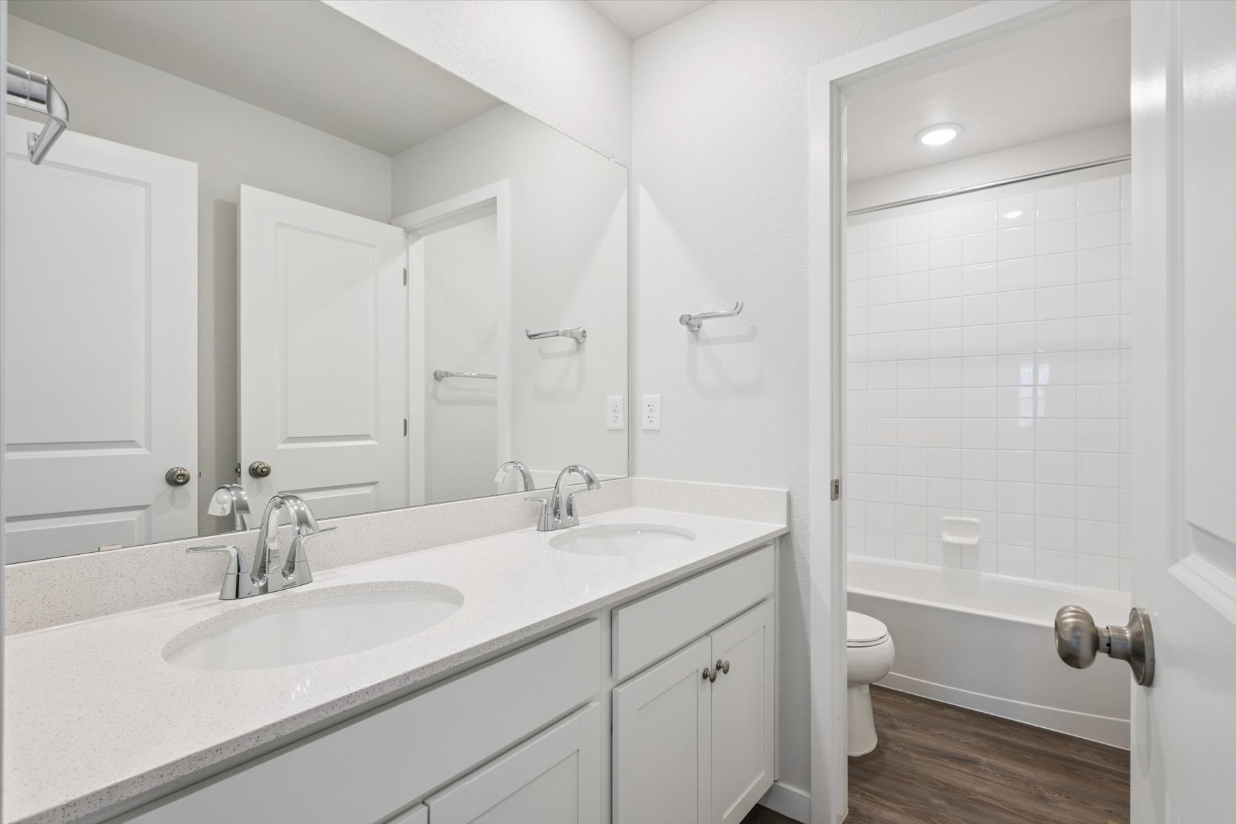 A bathroom with a sink toilet and shower.