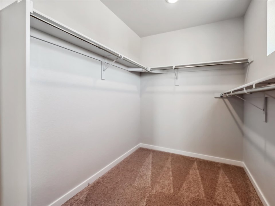 A white room with a tile floor.