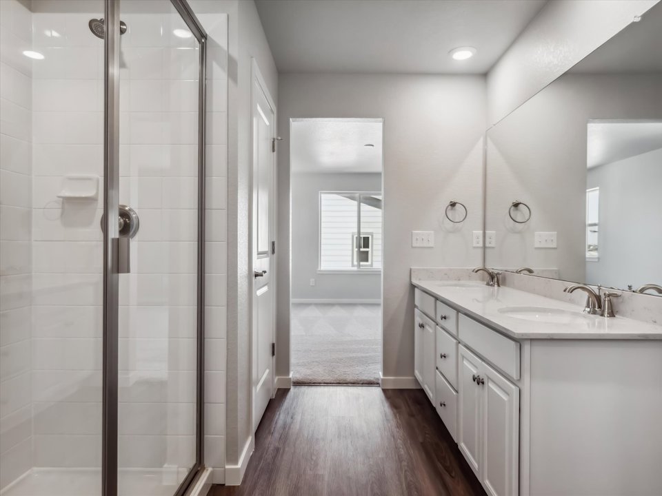 A bathroom with a glass shower.