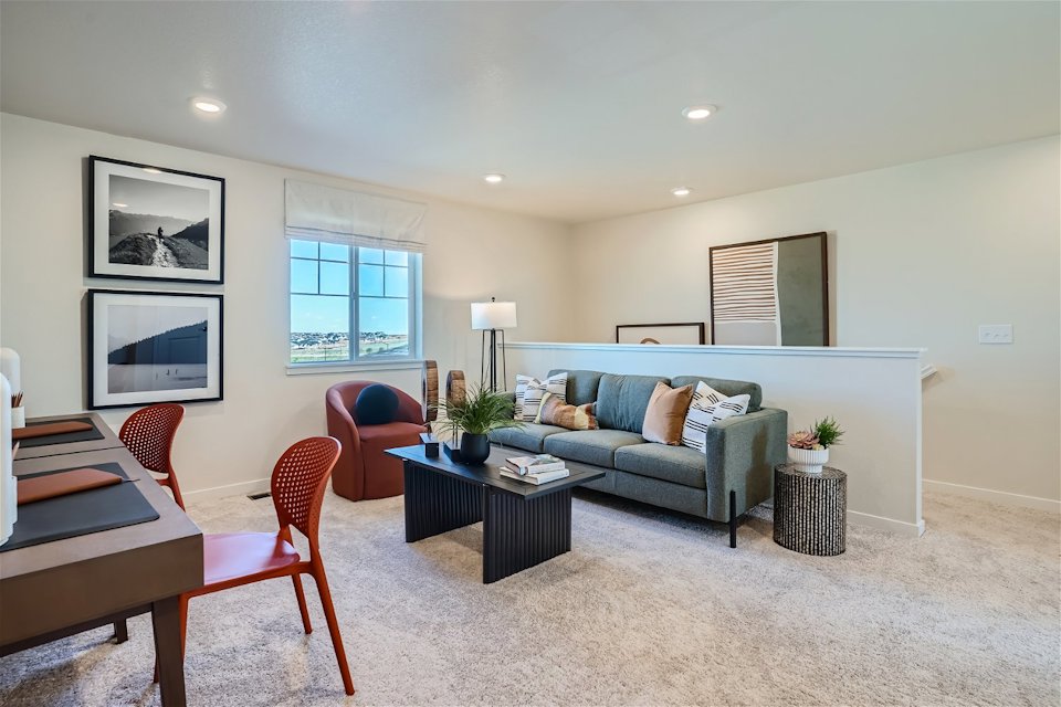 A living room with a couch and a table.