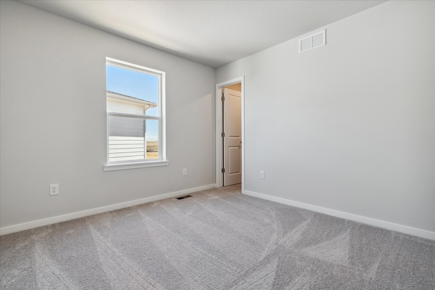 A room with a door and a window.