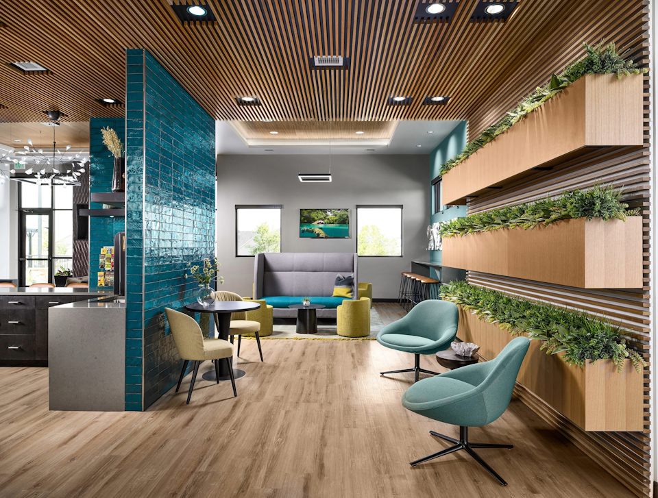 A room with a pool table and chairs.