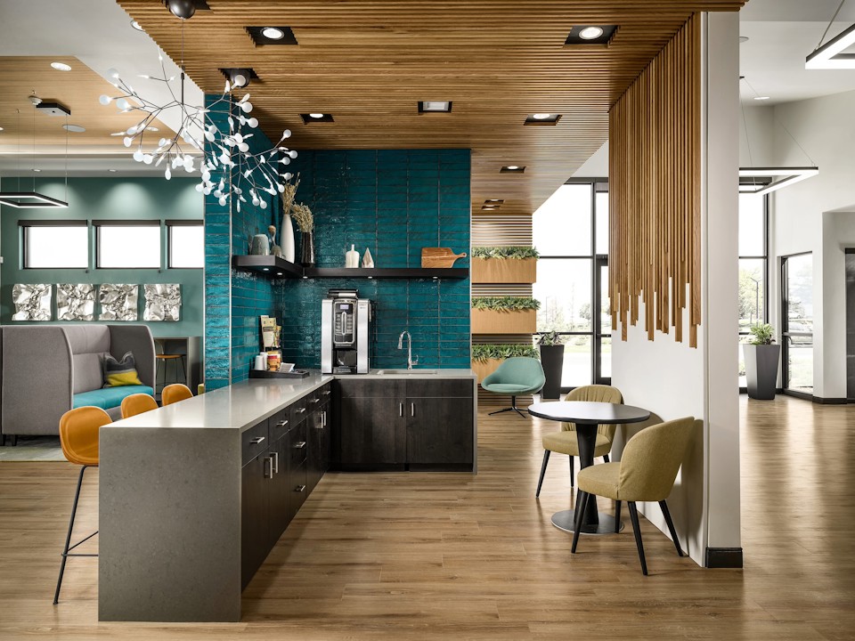 A room with a table chairs and a couch.