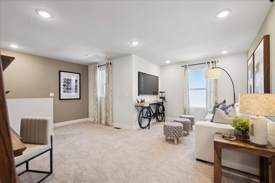 A living room with a couch and a table.