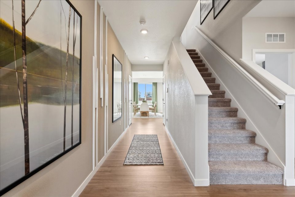 A long hallway with a glass door.