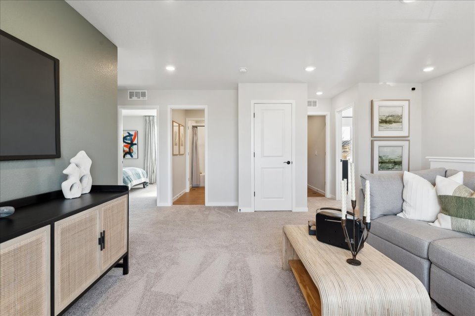 A living room with a couch and a tv.