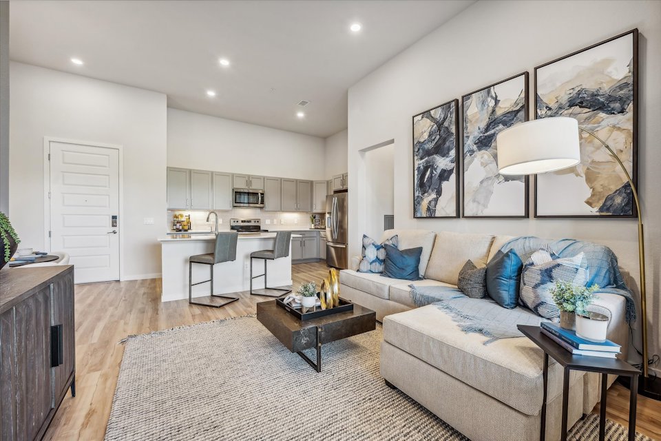 A living room with a couch and a table.