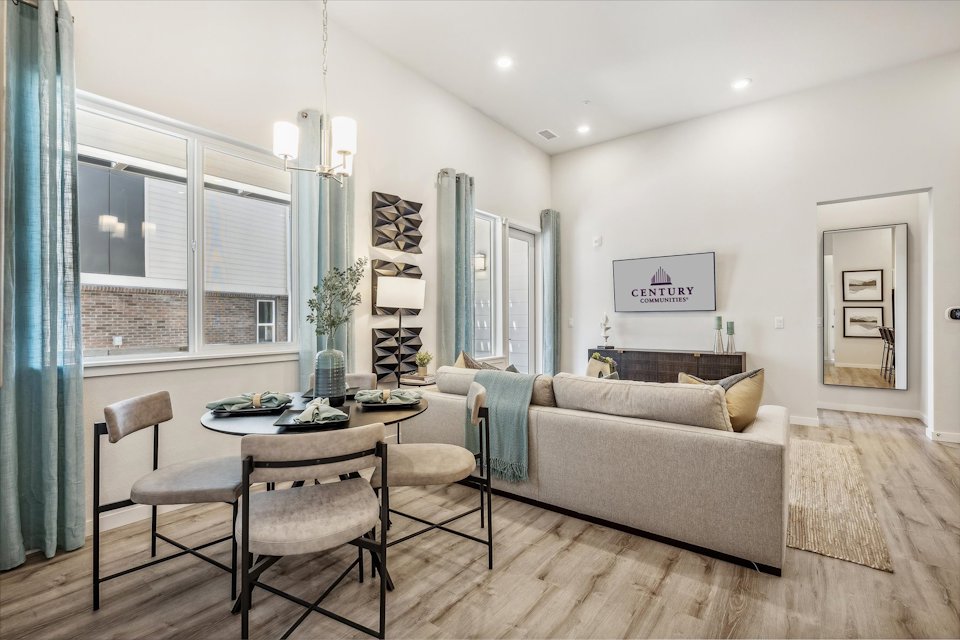 A living room with a couch and a table.