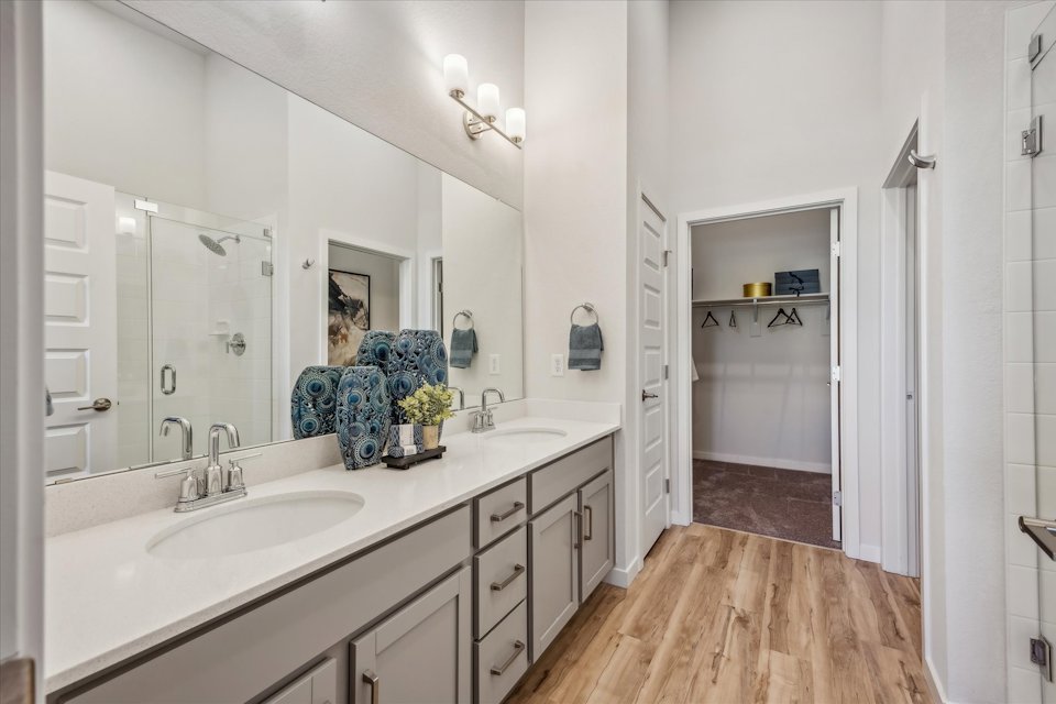 A bathroom with a large mirror.