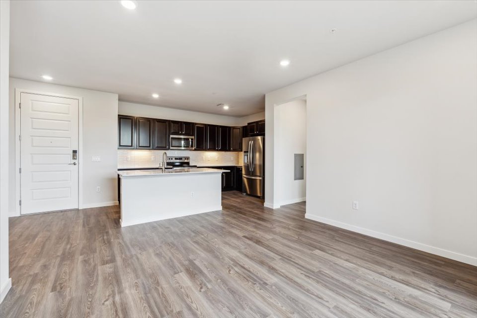 A kitchen with wooden floors.