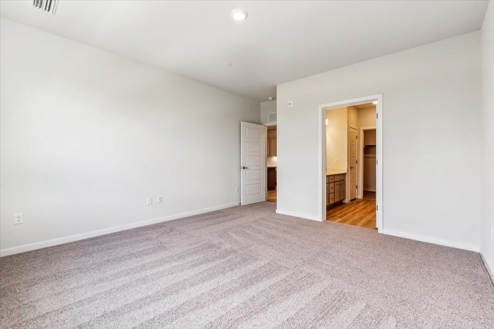 A hallway with white walls.
