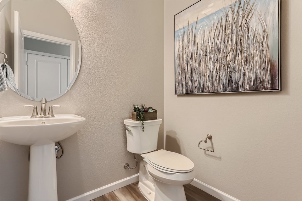 A bathroom with a sink and a toilet.