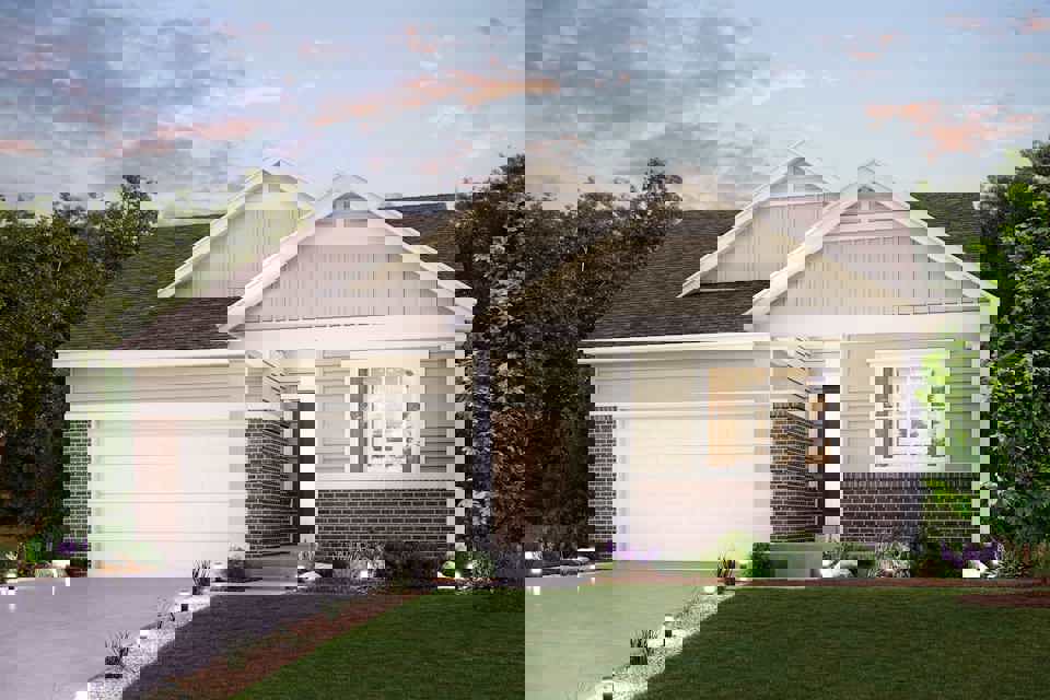 A house with a lawn and trees.