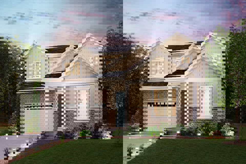 A house with a lawn and trees.