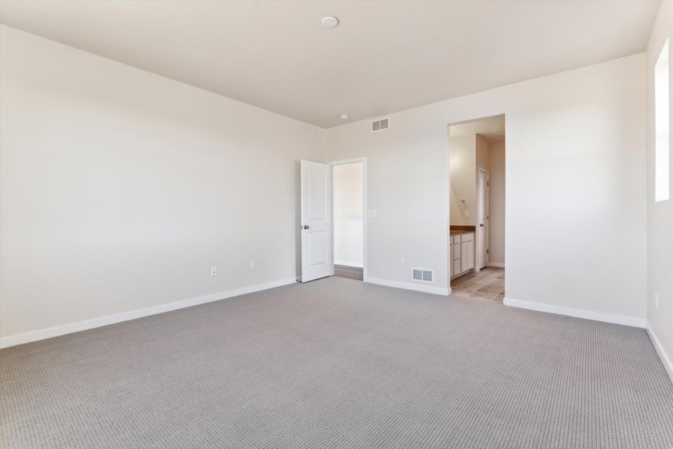 A long hallway with white walls.