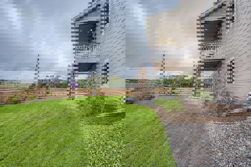 A house with a grass yard.