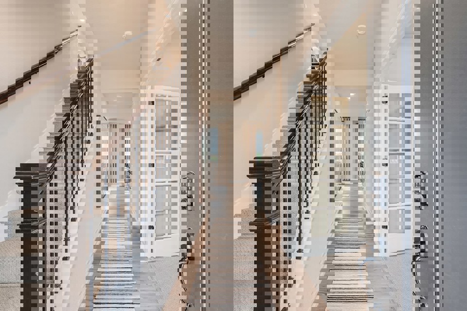 A hallway with white walls.