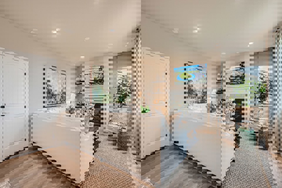 A large living room with a fireplace.