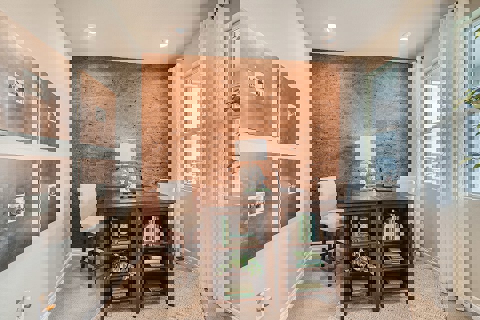 A room with a table and chairs.