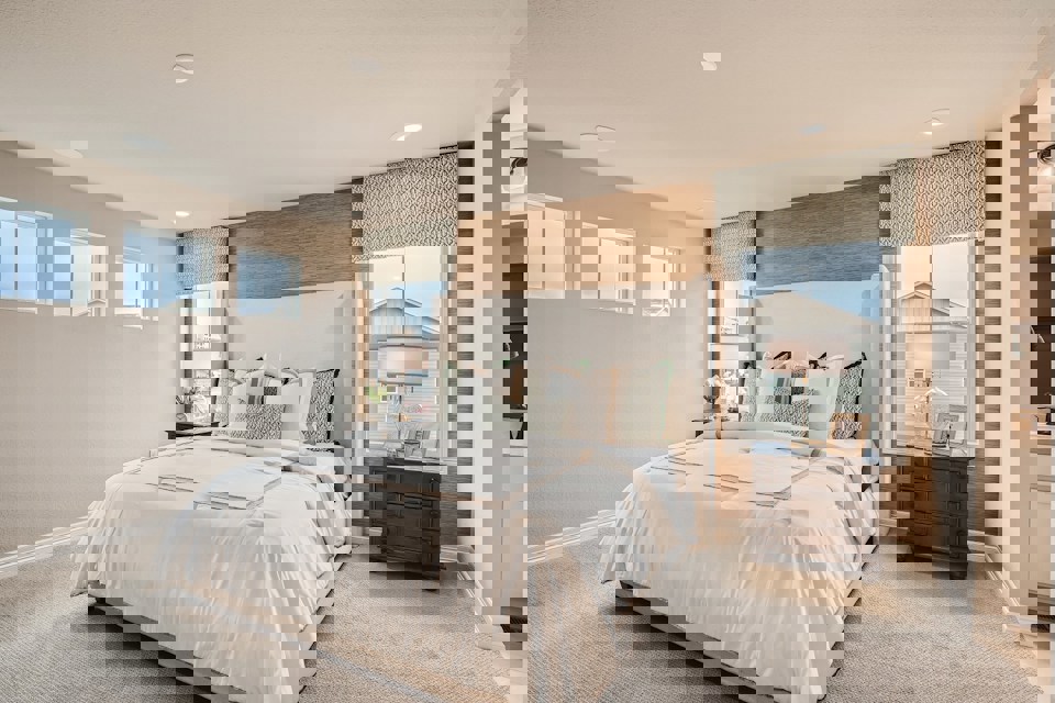 A bedroom with a large bed.