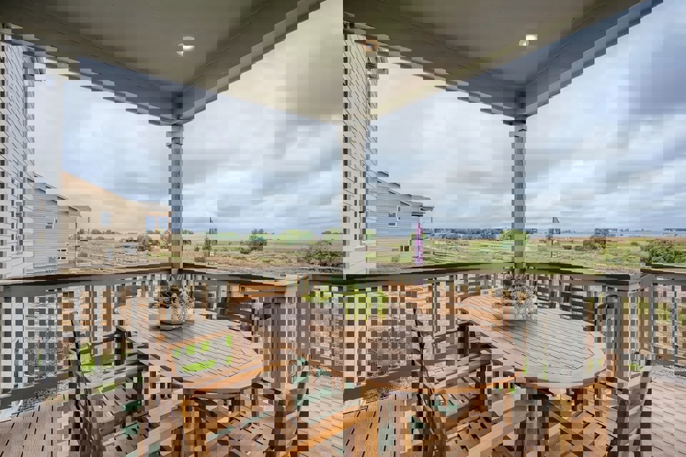 A table and chairs on a deck.