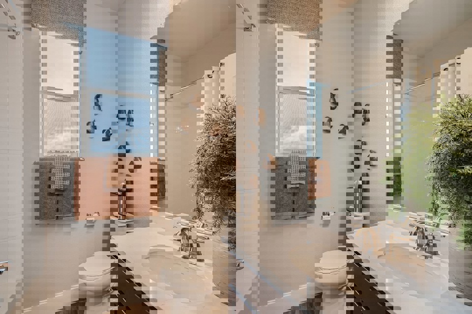 A bathroom with a sink and a toilet.