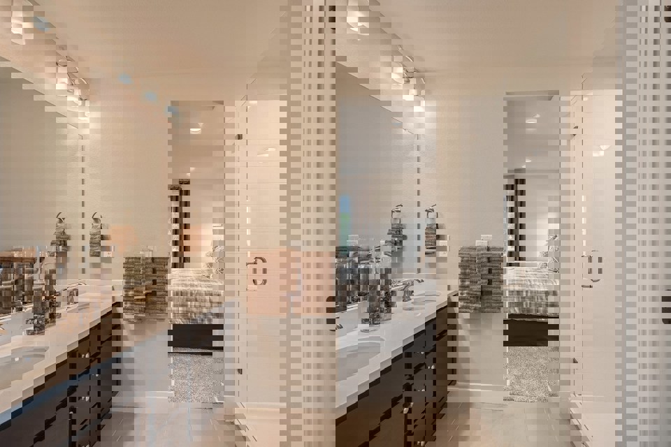 A bathroom with a tub sink and a shower.