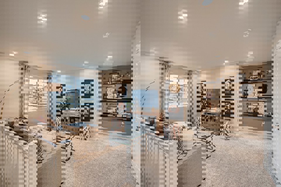 A living room with a tv and couches.