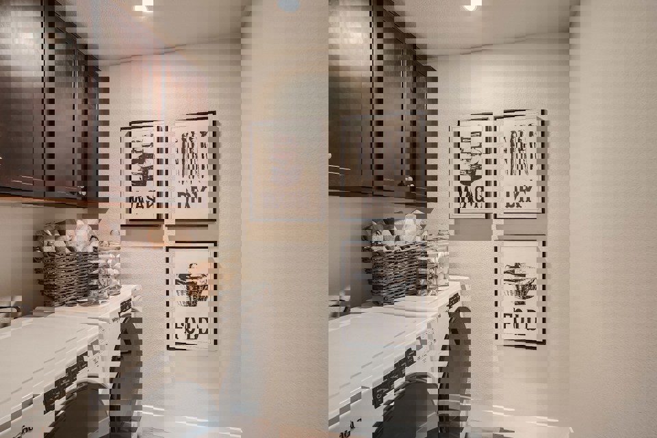 A kitchen with a white stove and a white radiator.