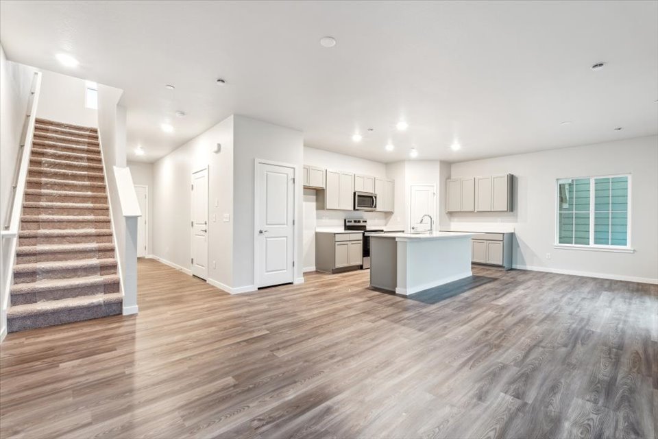 A large kitchen with white cabinets.