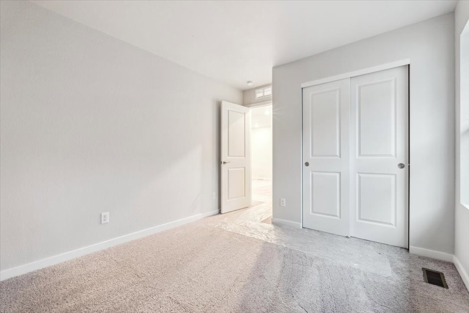 A hallway with white doors.