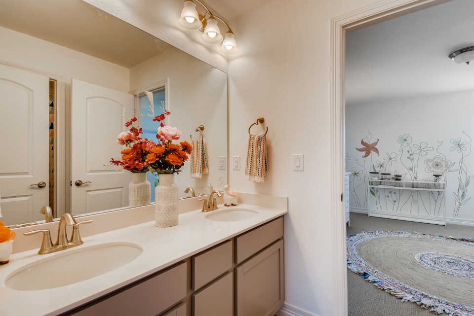 A bathroom with a large mirror.