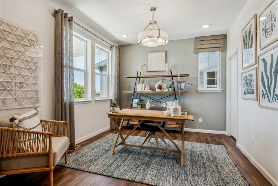 A room with a table and chairs.